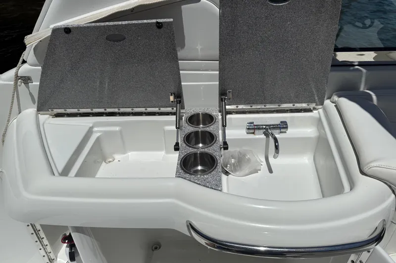 Slide: The Image of 2007 Formula 330 Sun Sport boat sink with cup holders and faucet. - 12
