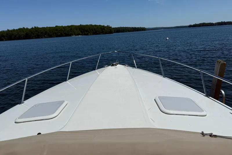 Slide: The Image of Front view of a 2007 Formula 330 Sun Sport boat on a calm lake. - 7