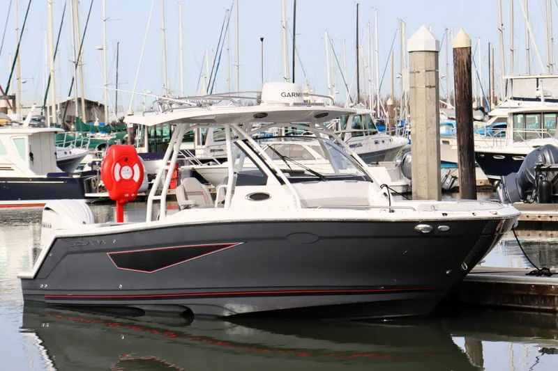 The Image of 2025 Solara S-250 CW boat docked in marina, surrounded by other vessels. - 0
