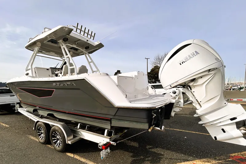 Slide: The Image of 2025 Solara S-250 CW boat on trailer with Yamaha outboard motor. - 14