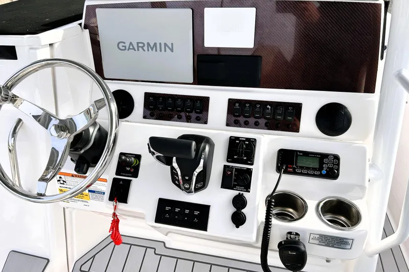 Slide: The Image of Helm of 2025 Solara S-250 CW boat with Garmin navigation system and controls. - 17