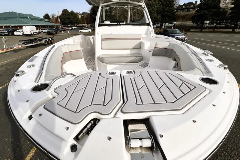 Slide: The Image of 2025 Solara S-250 CW boat with spacious seating and modern design in a parking area. - 22