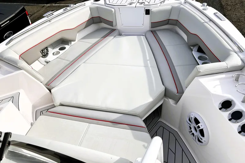 Slide: The Image of Luxurious seating area on 2025 Solara S-250 CW boat with cup holders and speaker. - 26