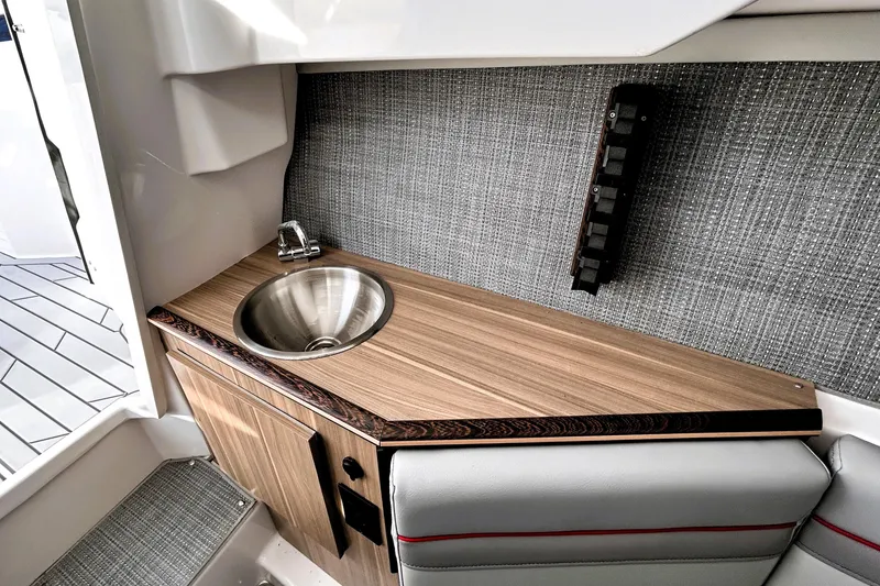 Slide: The Image of 2025 Solara S-250 CW interior with sleek sink and modern wood finish. - 40