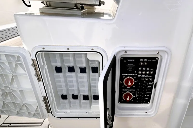 Slide: The Image of Control panel and storage compartment on 2025 Solara S-250 CW boat. - 42