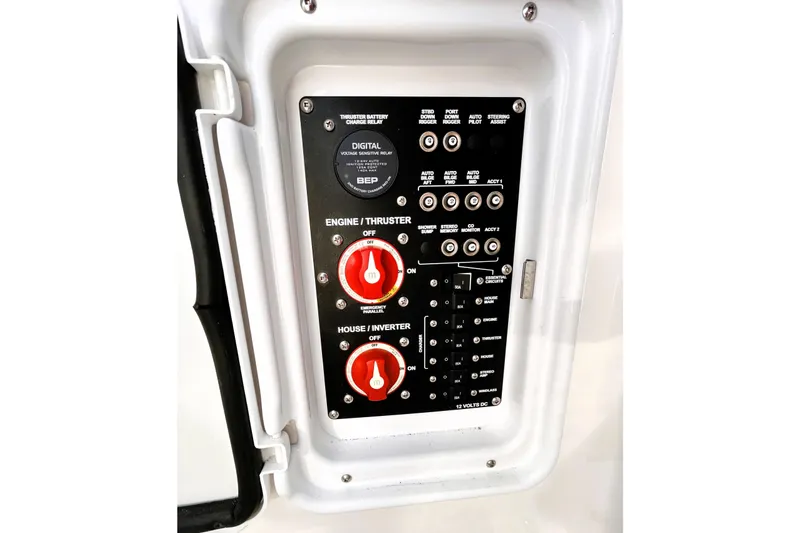 Slide: The Image of Control panel of a 2025 Solara S-250 CW boat with switches and dials. - 43