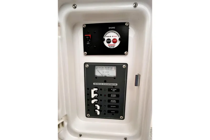 Slide: The Image of Electrical control panel of 2025 Solara S-250 CW boat, featuring switches and voltage meter. - 44