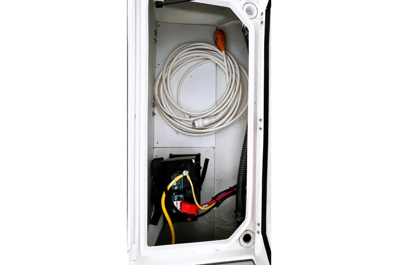 Slide: The Image of Interior view of Solara S-250 CW 2025 electrical compartment with coiled cables and battery. - 47