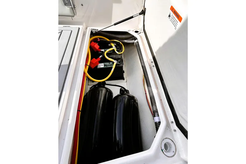 Slide: The Image of Battery compartment of 2025 Solara S-250 CW boat with cables and components. - 48