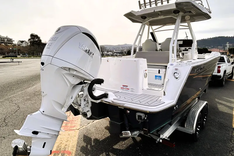 Slide: The Image of 2025 Solara S-250 CW boat with Yamaha outboard engine on trailer in parking lot. - 9