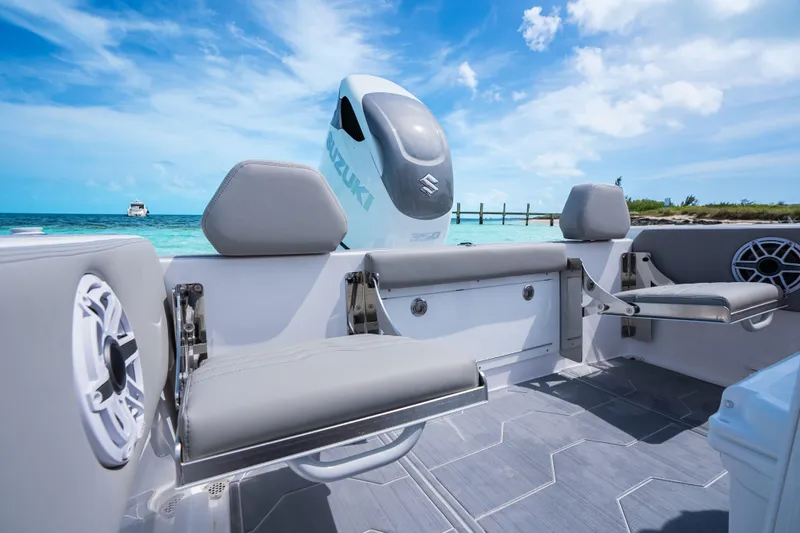 Slide: The Image of 2026 Dynamic D-250DF boat interior with Suzuki engine, ocean view, and modern seating. - 17
