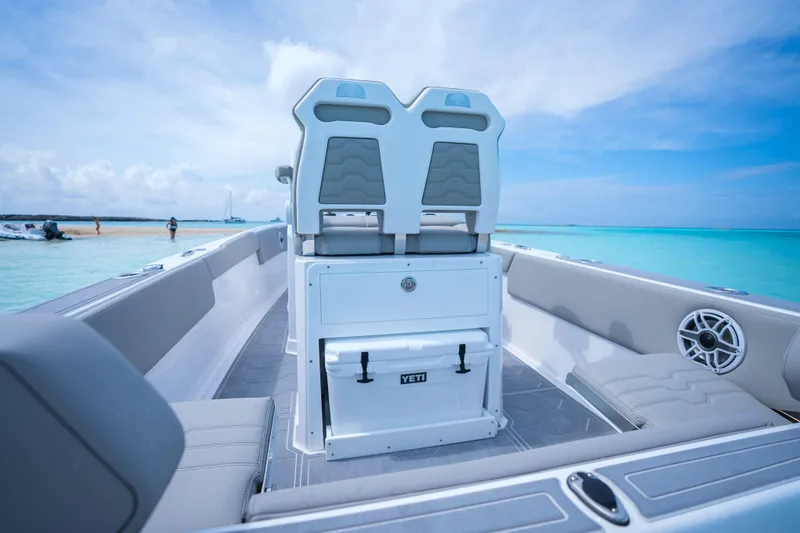 Slide: The Image of Dynamic D-250DF boat interior, 2026 model, featuring sleek seating and ocean backdrop. - 25