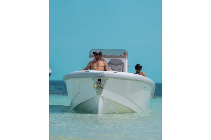 Slide: The Image of Man and child on Dynamic D-250DF boat in clear blue water, 2026 model. - 33