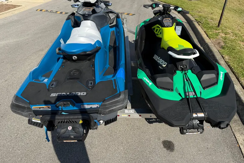 Slide: The Image of Two Sea-Doo jet skis, 2019 GTX model, parked on a trailer. - 10