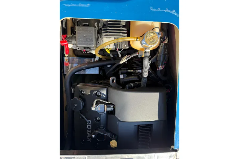 Slide: The Image of Engine compartment of a 2019 Sea-Doo GTX, featuring a Rotax engine and various components. - 11