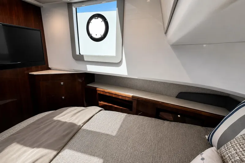 Slide: The Image of Luxurious cabin interior of 2024 Cruisers Yachts 50 GLS with modern furnishings. - 29
