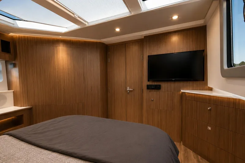 Slide: The Image of Luxurious interior cabin of 2024 Cruisers Yachts 50 GLS with modern wood finish. - 31