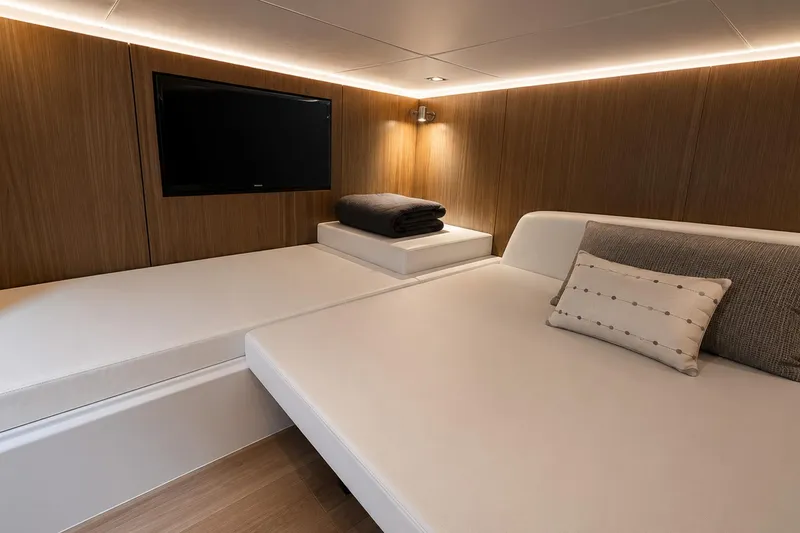 Slide: The Image of Luxurious cabin interior of 2024 Cruisers Yachts 50 GLS with modern decor and TV. - 32