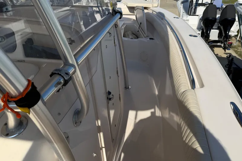 Slide: The Image of 2010 Grady-White Canyon 336 boat interior with stainless steel railings and seating area. - 14