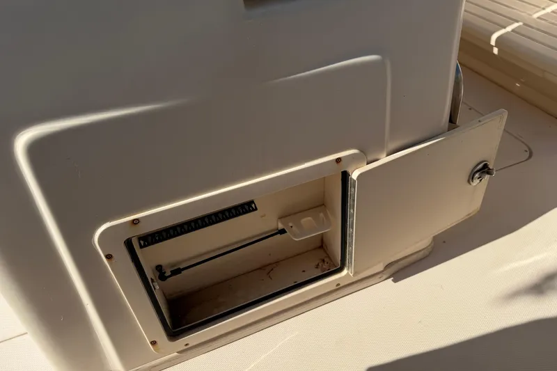 Slide: The Image of Open storage compartment on a 2010 Grady-White Canyon 336 boat. - 18
