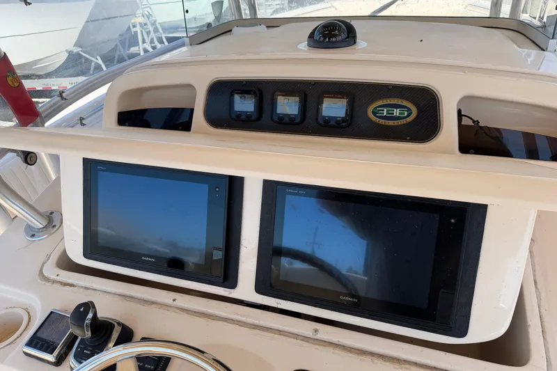 Slide: The Image of Dashboard of 2010 Grady-White Canyon 366 boat with Garmin displays. - 2