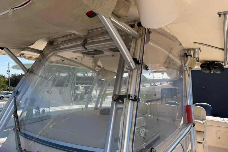 Slide: The Image of 2010 Grady-White Canyon 336 boat cockpit with clear windshield and sturdy frame. - 22