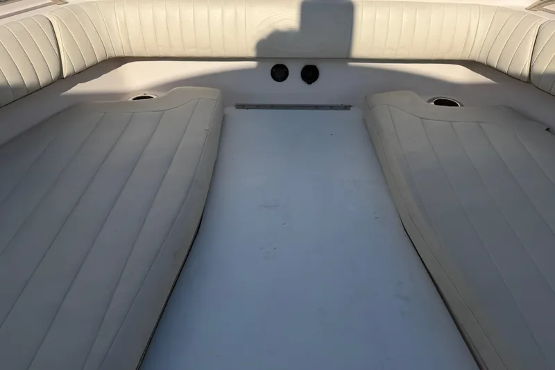 Slide: The Image of Interior view of a 2010 Grady-White Canyon 336 boat with cushioned seating. - 23