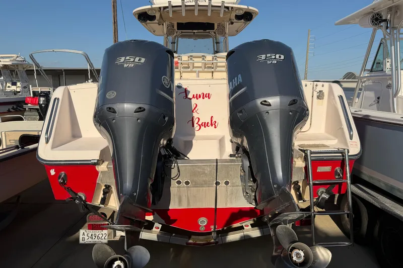 Slide: The Image of 2010 Grady-White Canyon 366 boat with twin Yamaha 350 engines, docked. - 3