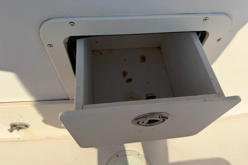 Slide: The Image of Open storage compartment on a 2010 Grady-White Canyon 336 boat. - 31