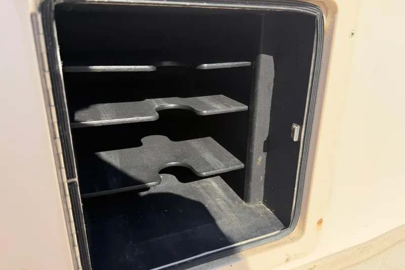 Slide: The Image of Open storage compartment on a 2010 Grady-White Canyon 336 boat. - 33