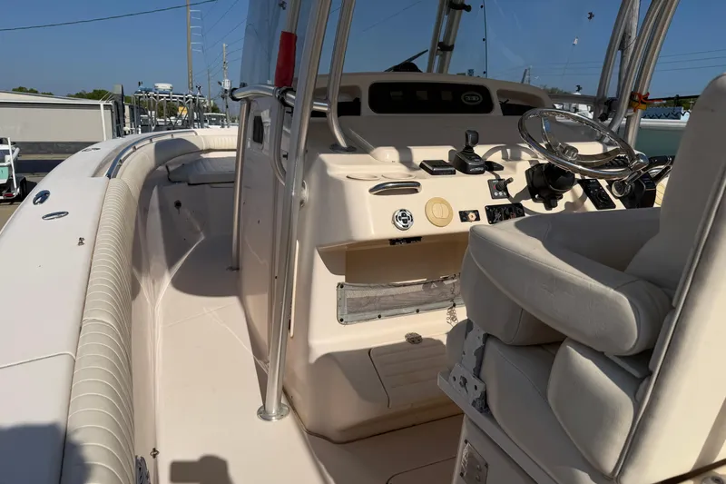 Slide: The Image of 2010 Grady-White Canyon 336 boat interior with steering console and seating. - 39