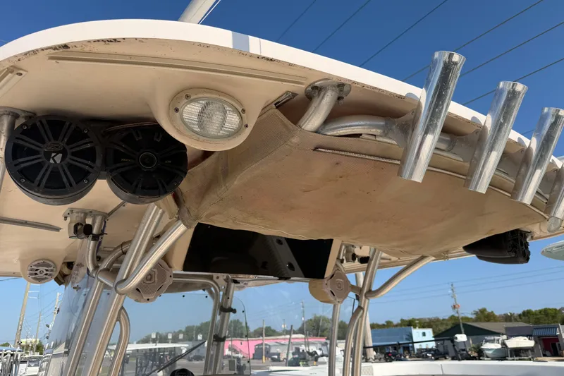 Slide: The Image of 2010 Grady-White Canyon 336 boat with rod holders and speakers on the T-top. - 42