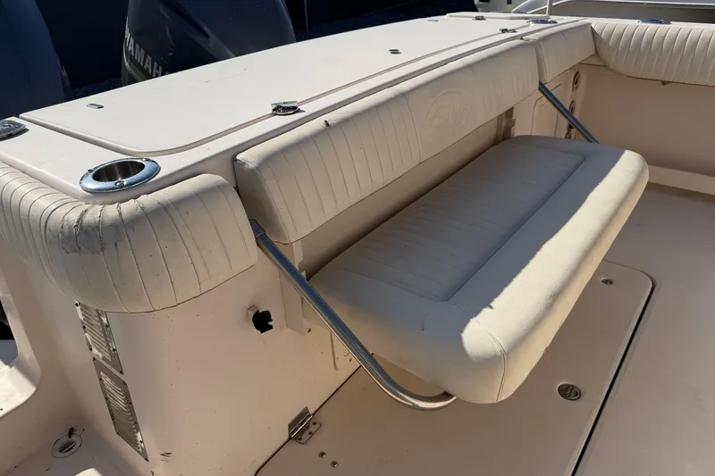 Slide: The Image of 2010 Grady-White Canyon 336 boat with cushioned seating and stainless steel fixtures. - 44