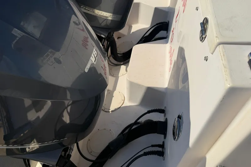 Slide: The Image of 2010 Grady-White Canyon 336 boat with dual outboard engines, featuring Yamaha V8 motors. - 46