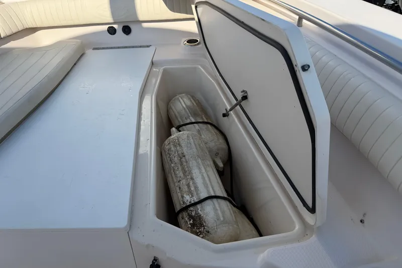 Slide: The Image of 2010 Grady-White Canyon 336 boat storage compartment with fenders inside. - 48