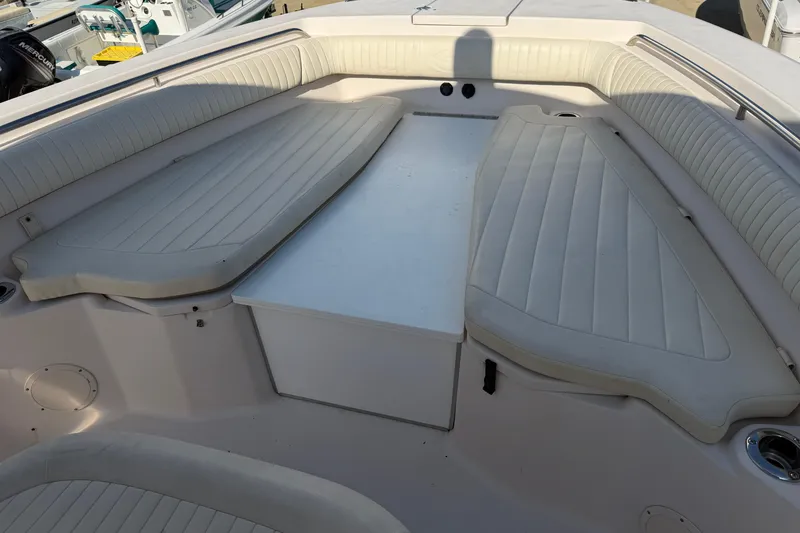 Slide: The Image of 2010 Grady-White Canyon 336 boat interior with cushioned seating and storage. - 50