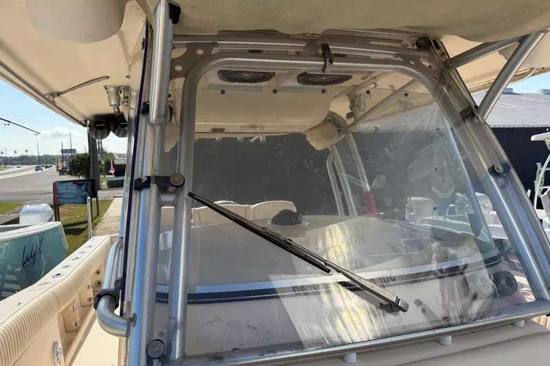 Slide: The Image of 2010 Grady-White Canyon 336 boat windshield and cockpit view. - 51