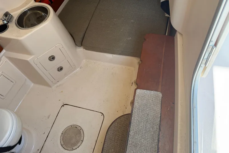 Slide: The Image of Interior of 2010 Grady-White Canyon 336 boat with seating and storage compartments. - 57