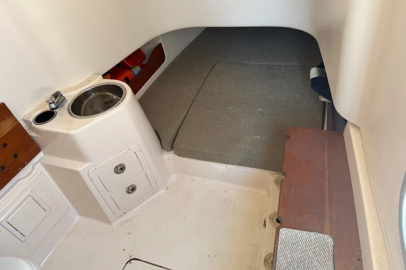 Slide: The Image of 2010 Grady-White Canyon 336 cabin interior with sink and storage compartments. - 58