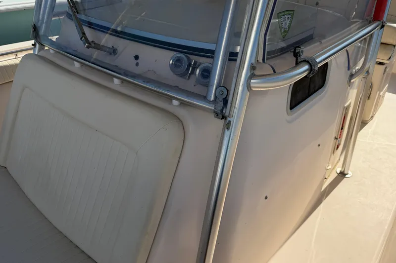 Slide: The Image of 2010 Grady-White Canyon 336 boat console with windshield and railing. - 59