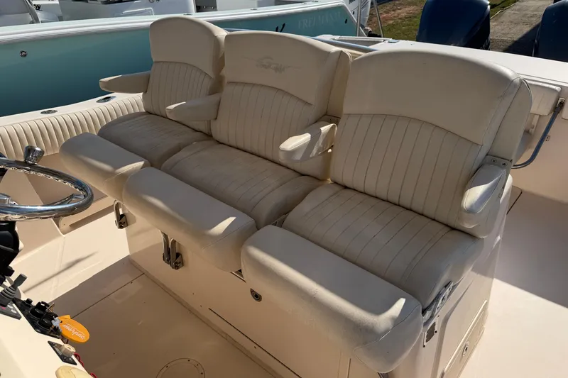 Slide: The Image of 2010 Grady-White Canyon 336 boat seating area with plush, cream-colored upholstery. - 63