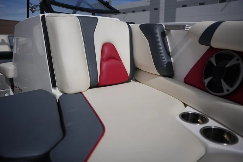 Slide: The Image of Interior of 2018 Malibu Wakesetter 21 VLX with red and gray accents. - 11
