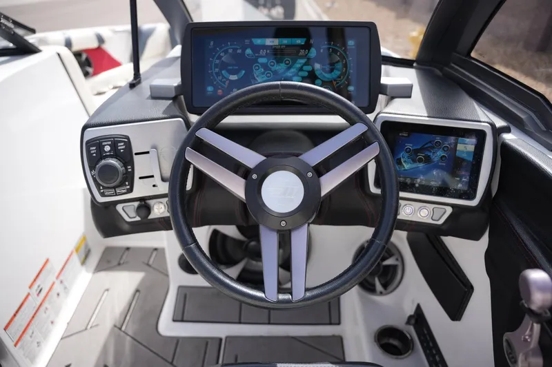 Slide: The Image of 2018 Malibu Wakesetter 21 VLX steering console with touchscreen displays. - 12