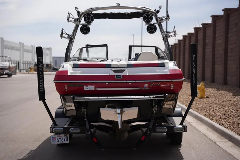 Slide: The Image of Rear view of a 2018 Malibu Wakesetter 21 VLX boat on a trailer. - 3