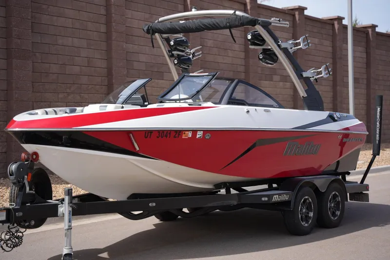 Slide: The Image of 2018 Malibu Wakesetter 21 VLX boat on trailer, red and white. - 8
