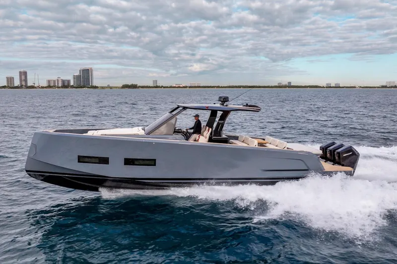 Slide: The Image of 2026 Pardo Yachts P43R cruising on open water under a cloudy sky. - 10