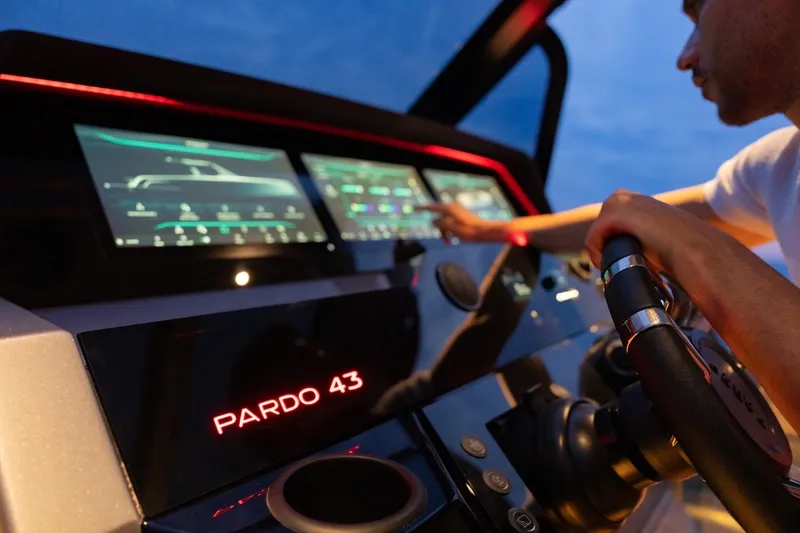 Slide: The Image of Cockpit of 2026 Pardo Yachts P43 with advanced touchscreen controls and steering wheel. - 26