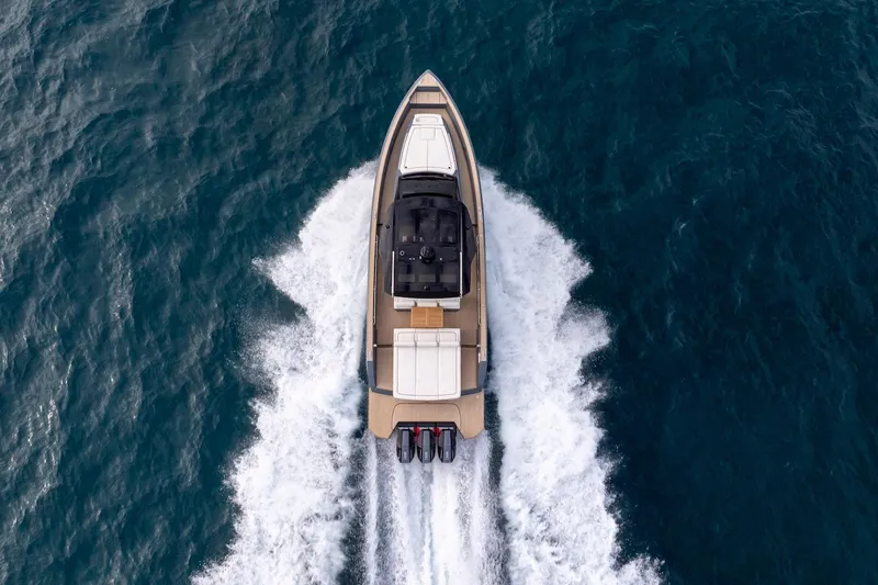Slide: The Image of 2026 Pardo Yachts P43R cruising on open water, aerial view. - 30