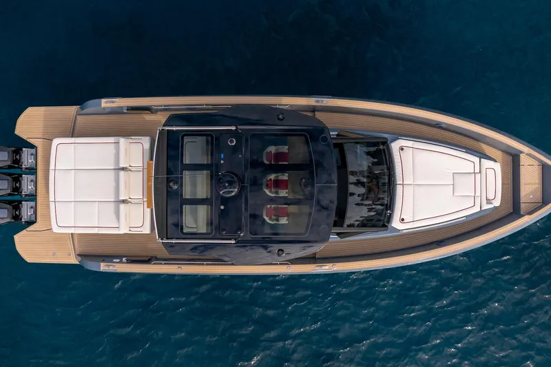Slide: The Image of Top view of 2026 Pardo Yachts P43R luxury yacht on blue water. - 4