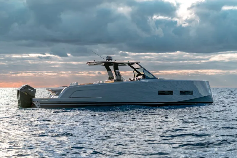Slide: The Image of 2026 Pardo Yachts P43R cruising on open water at sunset. - 7
